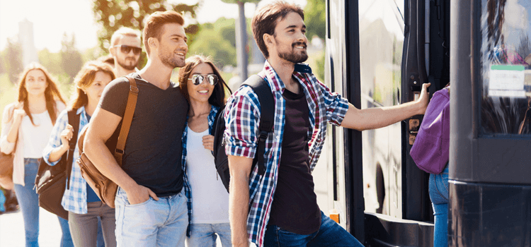 a group of people board a milwaukee charter bus