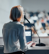 a woman speaking to a group