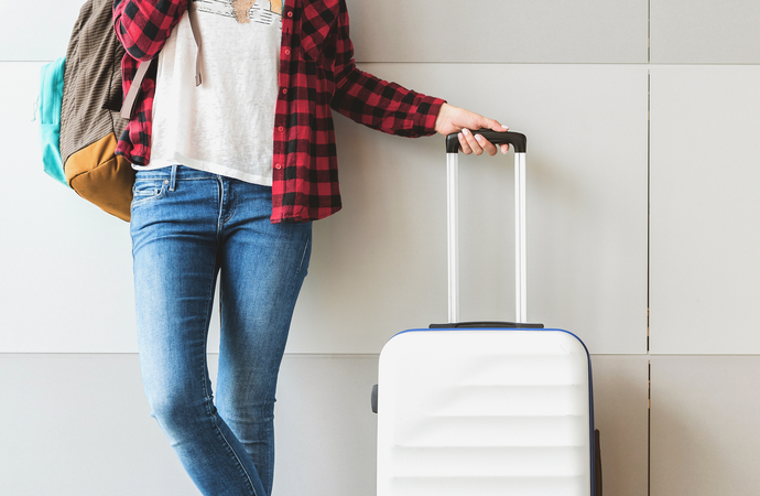 closeup of a passenger with luggage