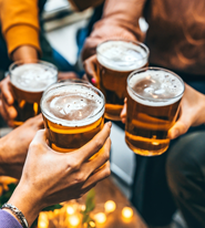 a group of friends holding beers